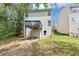 Two-story house with a deck, siding, and a spacious backyard at 6252 Shenfield Ln, Union City, GA 30291
