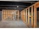 Unfinished basement with exposed rafters and concrete floor, ready for customization at 6252 Shenfield Ln, Union City, GA 30291