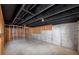 Unfinished basement with exposed rafters and concrete walls, ready for customization at 6252 Shenfield Ln, Union City, GA 30291