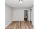 Bedroom with light gray walls, wood-look flooring, and two doors at 6252 Shenfield Ln, Union City, GA 30291