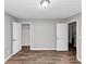 Bedroom with wood-look flooring, two doors, and light gray walls at 6252 Shenfield Ln, Union City, GA 30291