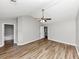 Bright bedroom featuring wood floors, ceiling fan, and view to connected bath at 6252 Shenfield Ln, Union City, GA 30291