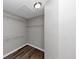 Walk in closet with wire rack shelving and wood flooring at 6252 Shenfield Ln, Union City, GA 30291