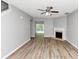 Bright living room features new gray paint, a fireplace and beautiful laminate flooring at 6252 Shenfield Ln, Union City, GA 30291