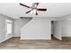 Bright living room features new gray paint, a ceiling fan and beautiful laminate flooring at 6252 Shenfield Ln, Union City, GA 30291