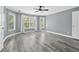 Spacious primary bedroom with natural light from many windows at 628 Warren Ave, Scottdale, GA 30079