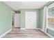 Bedroom with hard surface flooring and view to a laundry room at 628 Warren Ave, Scottdale, GA 30079