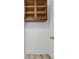 Storage space with wood shelving and modern door handle at 628 Warren Ave, Scottdale, GA 30079