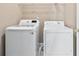 Bright laundry room with a modern washer and dryer at 628 Warren Ave, Scottdale, GA 30079