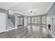 Open living room with a fireplace, fan, and ample natural light, perfect for entertaining at 628 Warren Ave, Scottdale, GA 30079