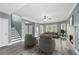 Spacious living room with fireplace, fan, and modern decor, creating a welcoming atmosphere at 628 Warren Ave, Scottdale, GA 30079