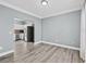 Open concept living room with view of kitchen and stainless steel refrigerator at 628 Warren Ave, Scottdale, GA 30079