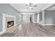 Spacious living room with fireplace and plenty of natural light, creating a warm and inviting space at 628 Warren Ave, Scottdale, GA 30079