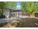 Backyard patio area with a pergola and landscaping at 877 Lee Andrews Se Ave, Atlanta, GA 30315
