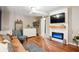 Finished basement with a media area, fireplace, and light laminate wood flooring at 877 Lee Andrews Se Ave, Atlanta, GA 30315