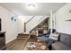 Finished basement featuring a comfortable seating area, shelving, and modern decor for versatile use at 877 Lee Andrews Se Ave, Atlanta, GA 30315