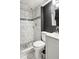 Bathroom featuring a tiled shower with modern fixtures, toilet, and vanity at 877 Lee Andrews Se Ave, Atlanta, GA 30315