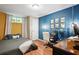 A cozy bedroom space with a dedicated work area featuring a desk and modern lighting at 877 Lee Andrews Se Ave, Atlanta, GA 30315