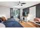 Well-lit bedroom with two beds, a decorative ceiling fan, and contemporary furnishings for comfort and style at 877 Lee Andrews Se Ave, Atlanta, GA 30315