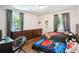 Bright bedroom with hardwood floors, two twin beds, and large windows offering plenty of natural light at 877 Lee Andrews Se Ave, Atlanta, GA 30315