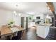 Bright kitchen with stainless appliances, white cabinetry, and a breakfast bar at 877 Lee Andrews Se Ave, Atlanta, GA 30315