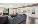 Open-concept living room with hardwood floors and a kitchen view at 877 Lee Andrews Se Ave, Atlanta, GA 30315