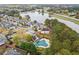 Scenic aerial view of a residential area with a lake, highlighting the community's natural surroundings at 681 Deer Springs Way, Loganville, GA 30052