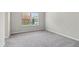 Spacious bedroom featuring large window and plush carpeting at 681 Deer Springs Way, Loganville, GA 30052