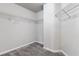 Walk-in closet with carpet and wire shelving at 681 Deer Springs Way, Loganville, GA 30052