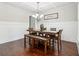 Elegant dining room with coffered ceilings, wood floors, and wainscoting at 681 Deer Springs Way, Loganville, GA 30052