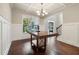 Elegant dining room features hardwood floors, wainscoting and coffered ceilings at 681 Deer Springs Way, Loganville, GA 30052