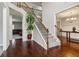 Open foyer features hardwood floors, staircase, and views into other living areas at 681 Deer Springs Way, Loganville, GA 30052