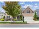 Charming two-story home features a well-manicured lawn, tasteful landscaping, and an attached two-car garage at 681 Deer Springs Way, Loganville, GA 30052