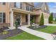 Inviting front porch with manicured landscaping and stylish entrance at 681 Deer Springs Way, Loganville, GA 30052