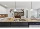 Gourmet kitchen features granite countertops, stainless steel appliances, and open layout at 681 Deer Springs Way, Loganville, GA 30052