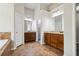 Main bathroom featuring double vanity, tile floors, and separate bathtub at 681 Deer Springs Way, Loganville, GA 30052