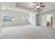 Expansive main bedroom featuring vaulted ceiling, two large windows, and an ensuite bathroom at 681 Deer Springs Way, Loganville, GA 30052
