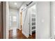 Walk-in pantry with barn door, offering ample storage space and convenient shelving at 681 Deer Springs Way, Loganville, GA 30052