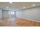 Finished basement with laminate flooring, drop ceiling, recessed lighting, and painted walls at 4309 Gilbert Pl, Forest Park, GA 30297
