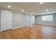 The renovated basement features laminate flooring, neutral walls, and recessed lighting at 4309 Gilbert Pl, Forest Park, GA 30297