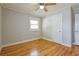 Bright bedroom with hardwood floors and a ceiling fan at 4309 Gilbert Pl, Forest Park, GA 30297