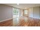 Bedroom featuring stylish laminate flooring, a sliding glass door to a deck, and ample natural light at 4309 Gilbert Pl, Forest Park, GA 30297