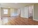 Spacious bedroom featuring laminate flooring, neutral walls, and convenient access to the adjoining bathroom at 4309 Gilbert Pl, Forest Park, GA 30297