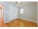 Neutral bedroom features hardwood floors and a double door closet at 4309 Gilbert Pl, Forest Park, GA 30297