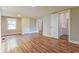Large bedroom featuring wood floors, neutral paint, two closets, and access to bathroom at 4309 Gilbert Pl, Forest Park, GA 30297
