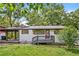 Charming single-story home with a covered carport and a cozy front porch at 4309 Gilbert Pl, Forest Park, GA 30297