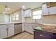 Modern kitchen with subway tile backsplash, stainless appliances, and bright natural light at 4309 Gilbert Pl, Forest Park, GA 30297