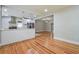 Open kitchen featuring white cabinets, breakfast bar, and stainless appliances with views to living area at 4309 Gilbert Pl, Forest Park, GA 30297