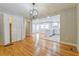 Bright open-concept living area featuring hardwood floors and seamless flow into the modern kitchen at 4309 Gilbert Pl, Forest Park, GA 30297