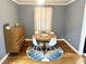 Lovely dining room with modern table and chairs, accented by a unique rug at 2447 Hillside Ave, Decatur, GA 30032